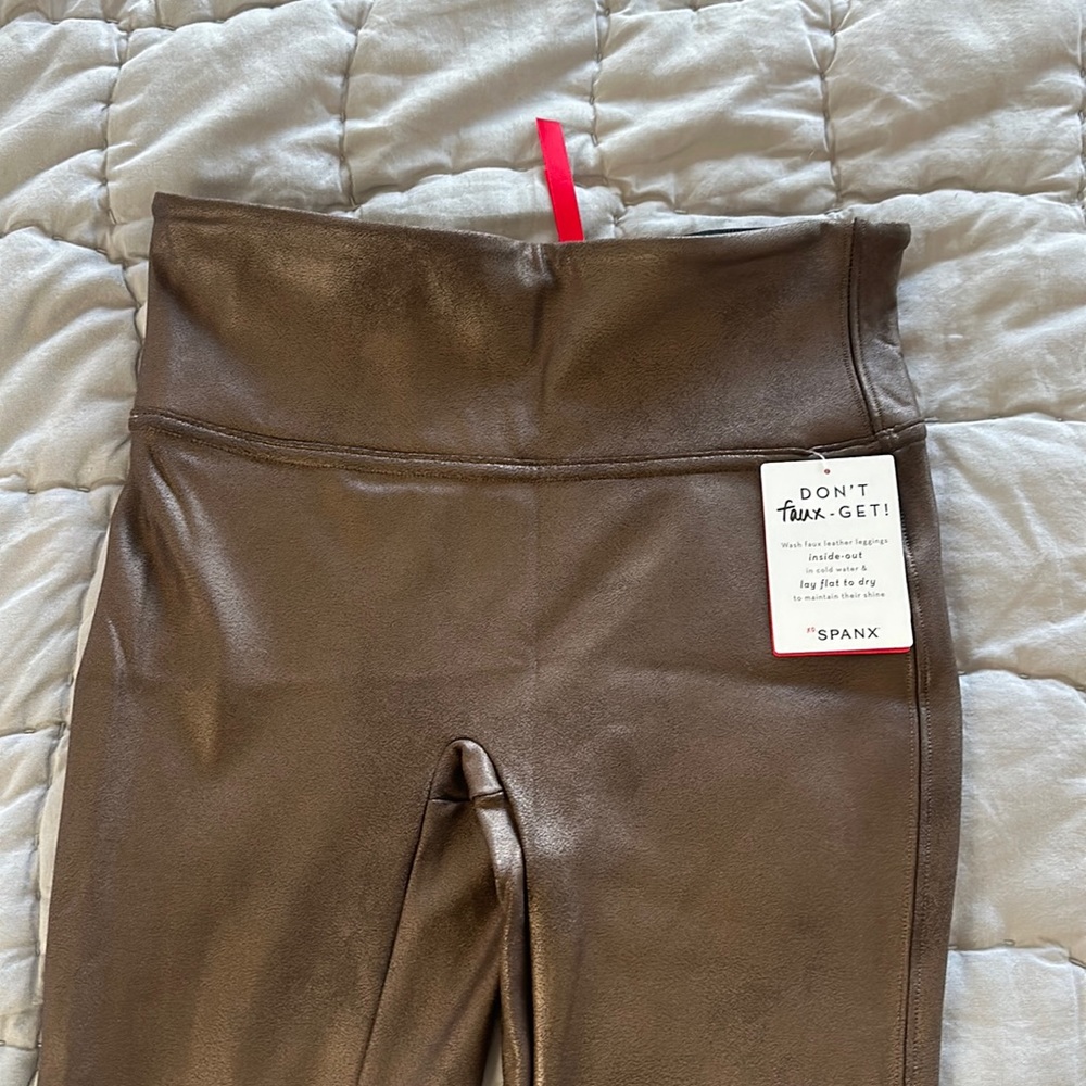 Brand new Spanx leggings. These are the leather type leggings - brown
